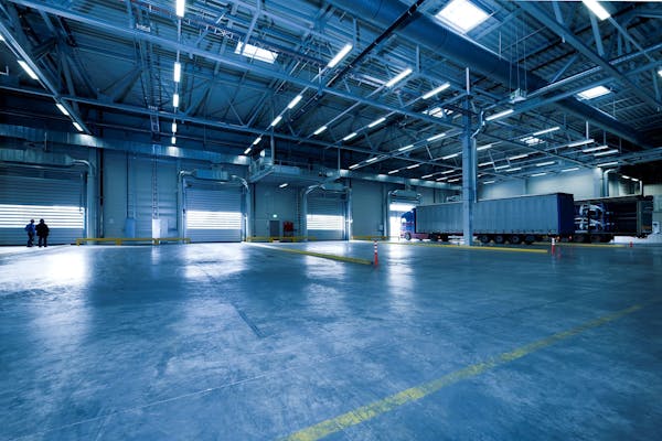 Warehouse interior with yellow floor markings and loading dock area